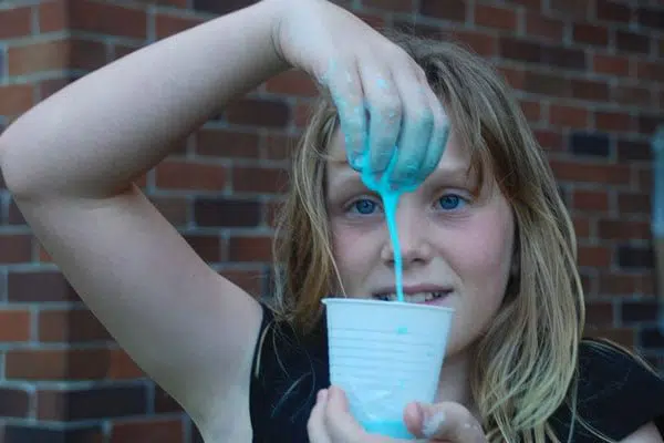 Child at slime school holiday workshop