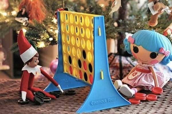 Elf playing games under tree