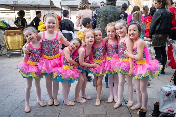 A crowd of young dancers before a show