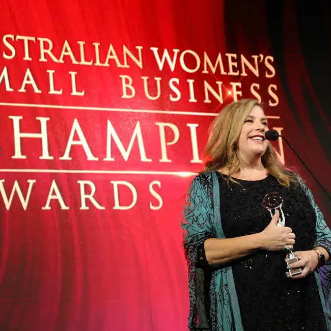 Kristina Duke accepting her Australian Women’s Small Business Champion award for Disability Support Services 2023