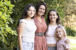 Rachel with her three daughters in 2024, just a few months before finding a lump