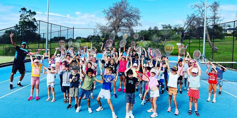 Enrol the kids in a tennis camp. Image: Evolve Tennis