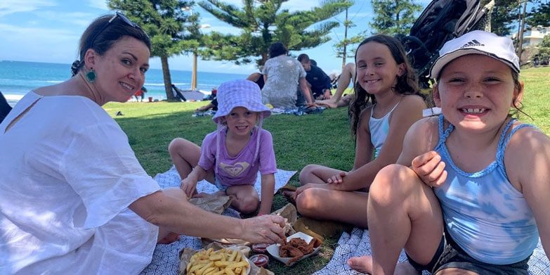 Fish and chips on the grass at Dee Why Beach