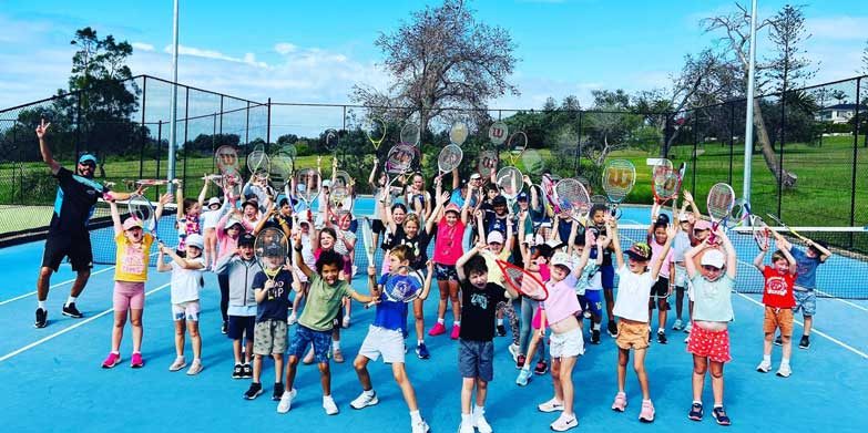 Enrol the kids in a tennis camp. Image: Evolve Tennis